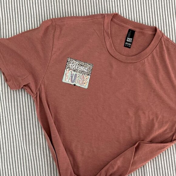 District Tops - Blessed Nurse Cheetah Logo Pink Short Sleeve Cool Nurse Tee Size Small